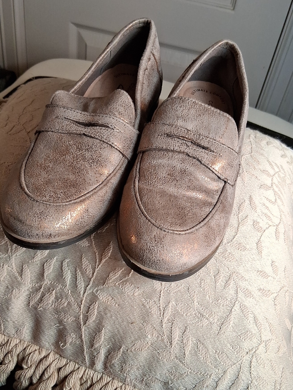 Clarks Trish Rose loafers in a copper metallic finish, featuring an almond toe